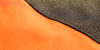 Detailed shot of vibrant orange and black fabric