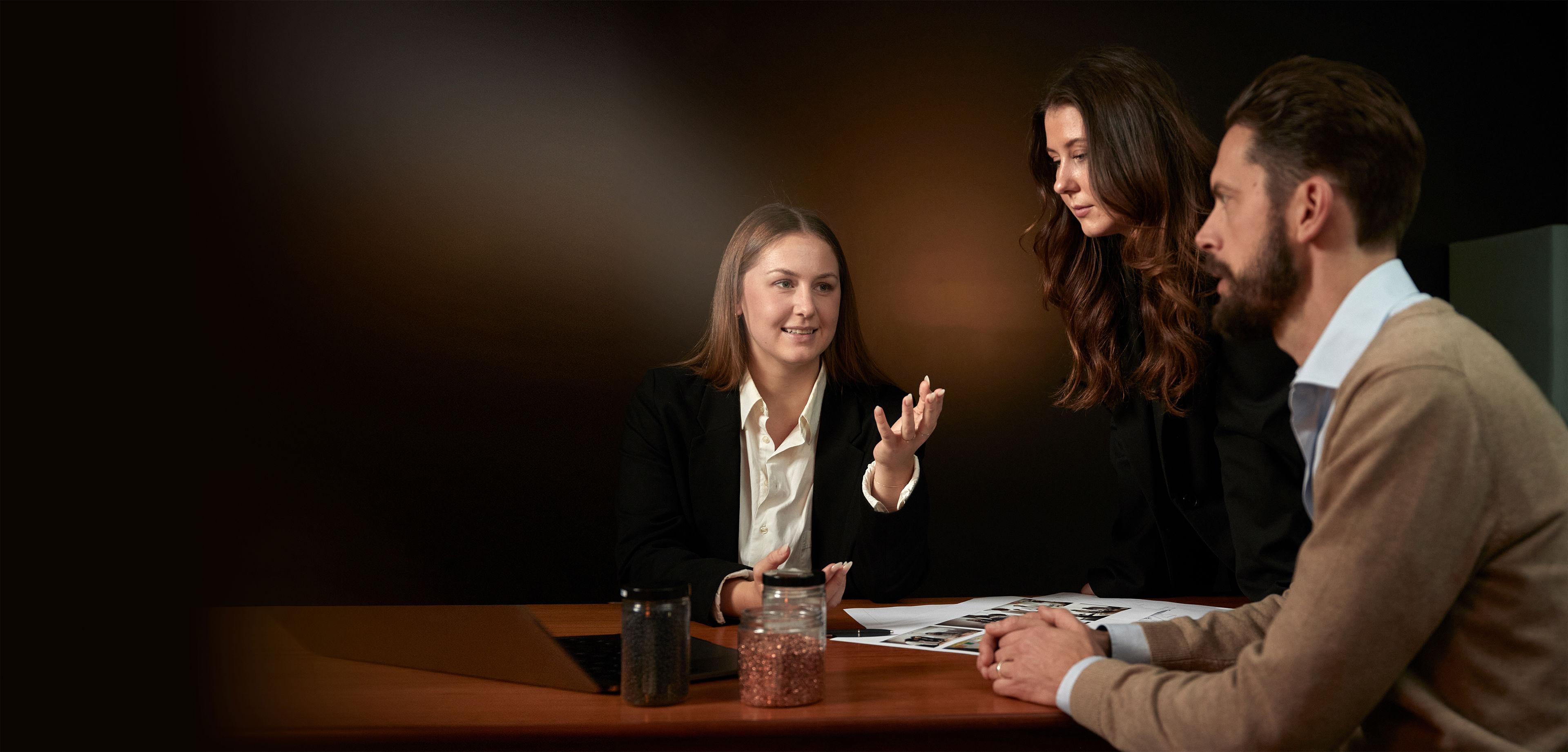 Three persons in an office