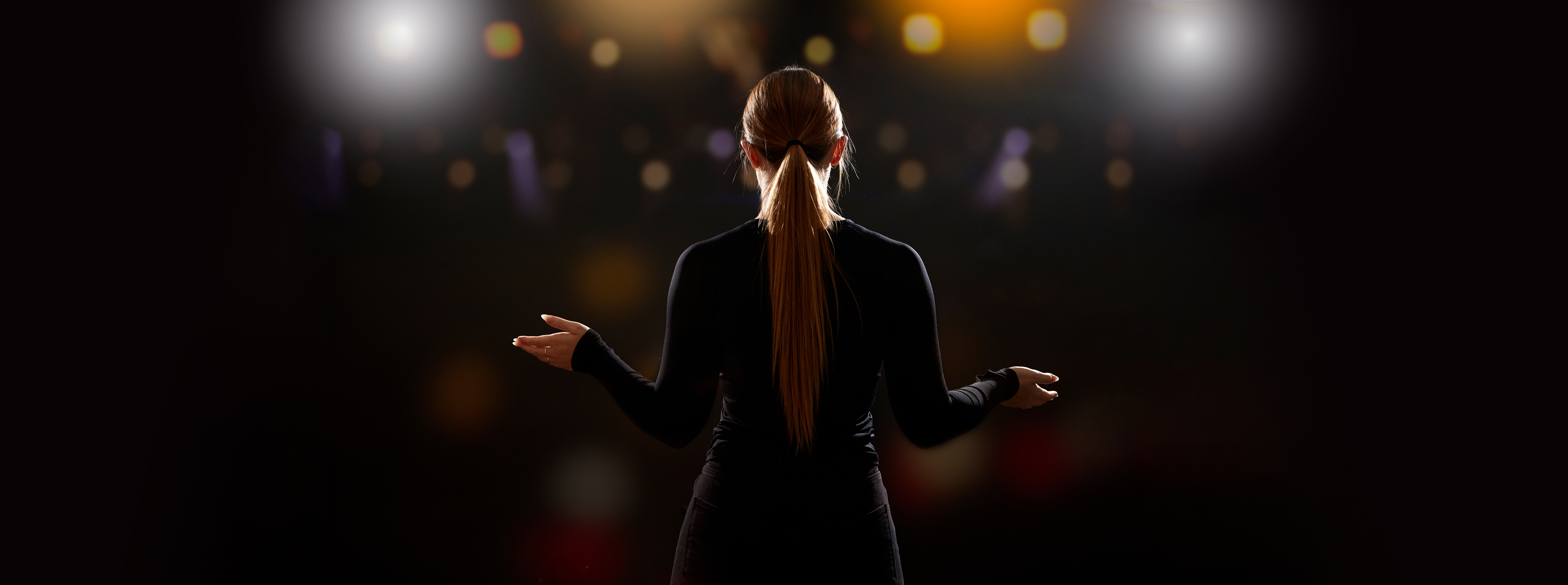 Woman in front of crowd